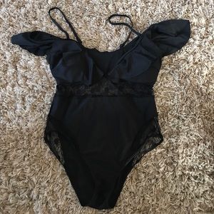 Black one piece. Size XL. Never been worn.
